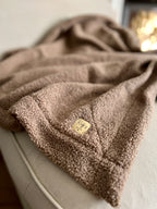 Morbida coperta in teddy bouclè